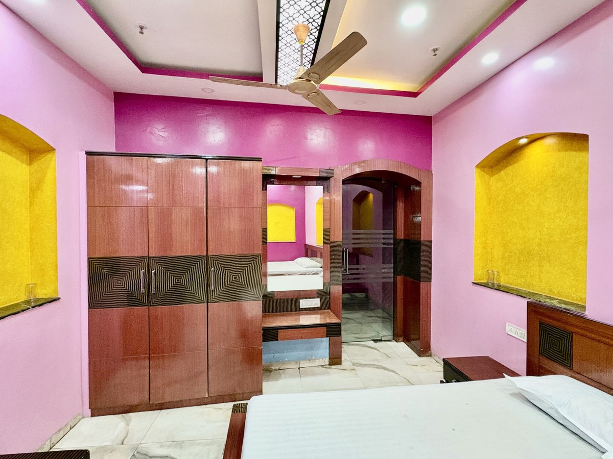 Interior of family guest house room in Kolkata with wardrobe